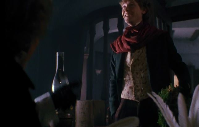 Not sure what Fred's looking at. Maybe his paycheck being held off-screen?